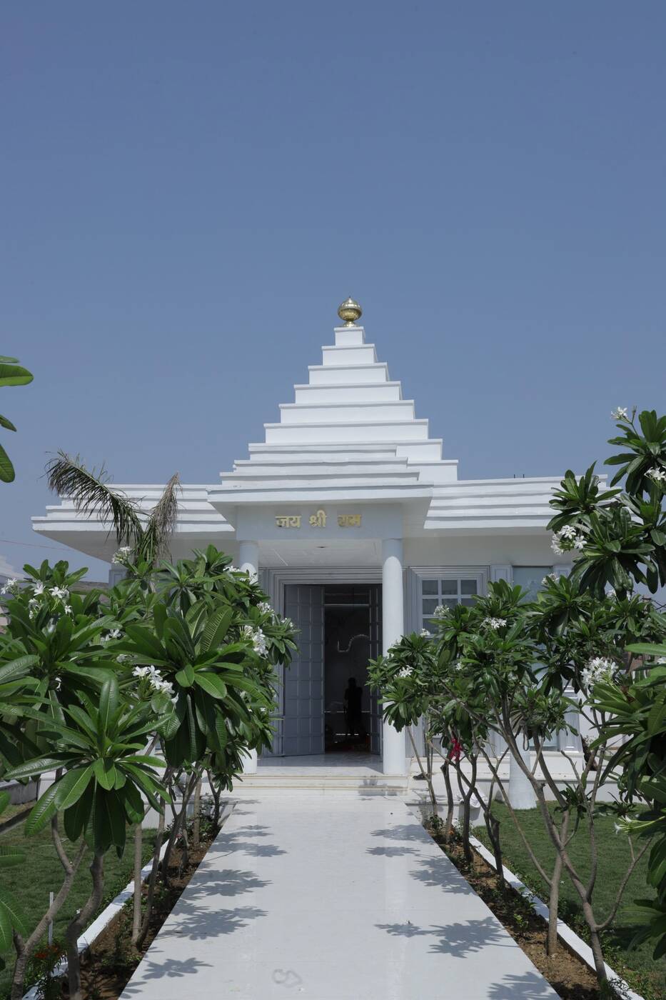 The marble spire of Ram Kripa temple against the sky, Hathras